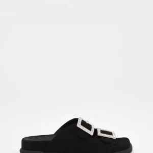 Sandalias planas negras con hebillas brillantes