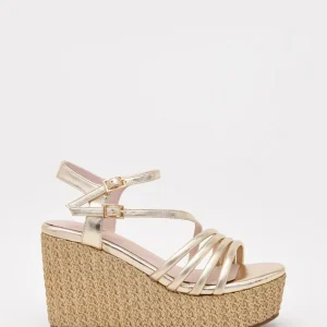 Sandalias doradas de cuña alta y plataforma trenzada